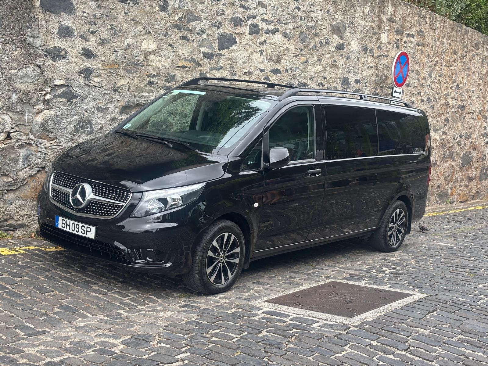 Black Mercedes-Benz Vito van parked, side view — MG Madeira Tours VIP fleet