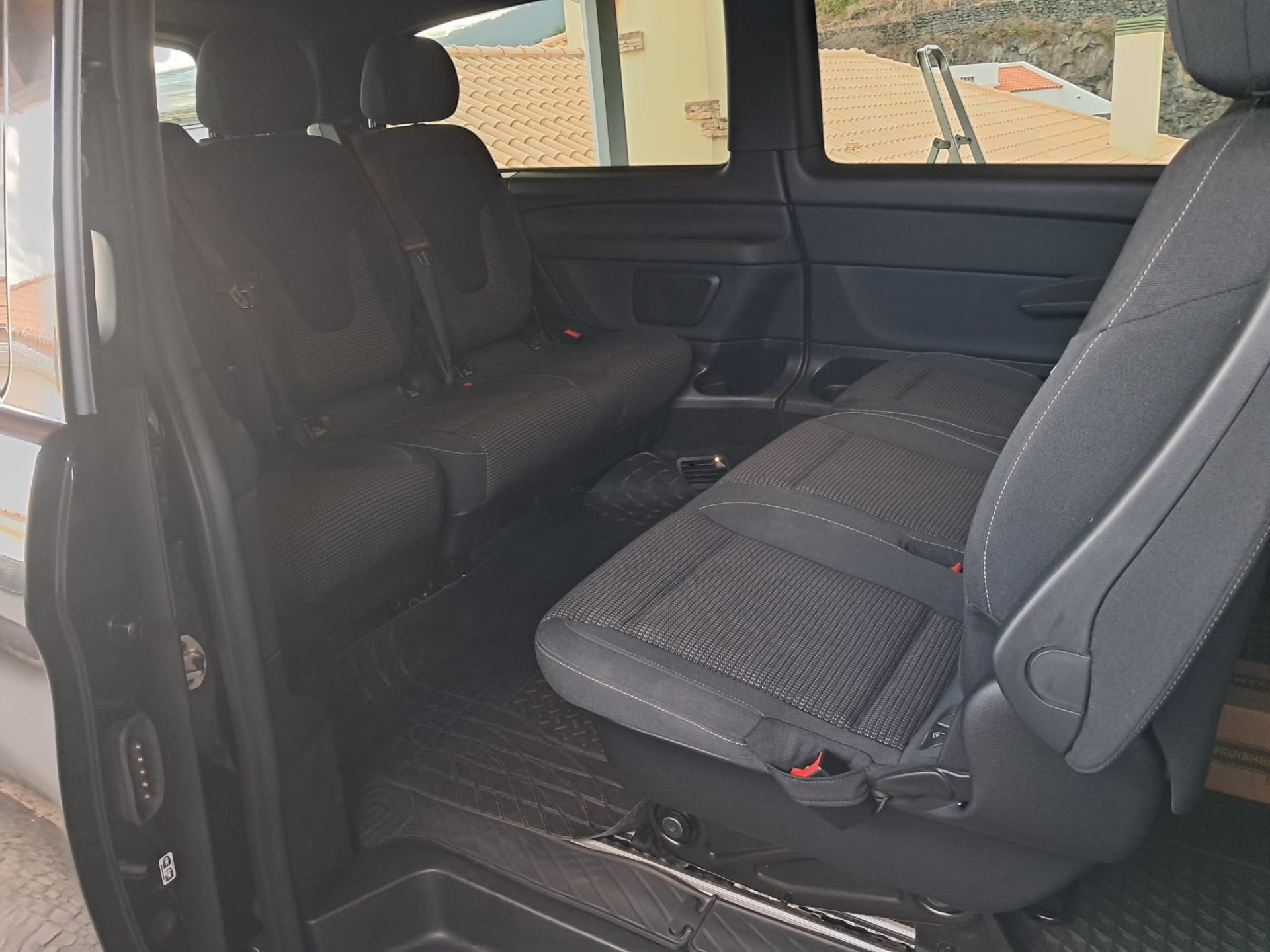 Interior of the Mercedes EQV showing the rear passenger seats in black